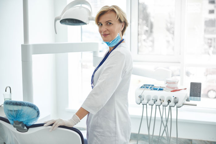 dentist-woman-smiling-joy-at-rest-in-office